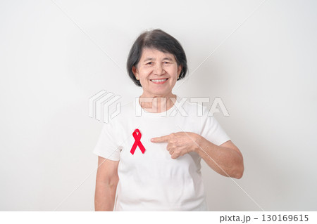 Elderly with Red Ribbon for December World Aids Day, MADD, October Red ribbon week, February Heart month, Marfan Syndrome, May Stroke awareness, March world TB Tuberculosis day and April Dare day Elderly with Red Ribbon for December World Aids Day, MADD, October Red ribbon week, February Heart month, Marfan Syndrome, May Stroke awareness, March world TB Tuberculosis day and April Dare day 130169615