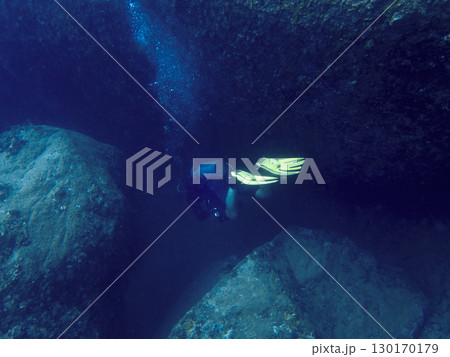 The driver floats over large rocks at the bottom of the South China Sea in Vietnam 130170179