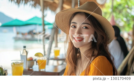 Beautiful Woman at Beachside Cafe 130170409
