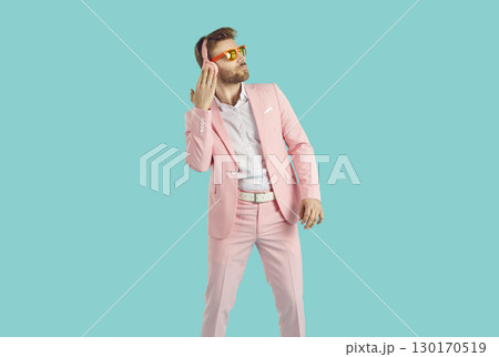 Handsome young man listening to music with headphones 130170519