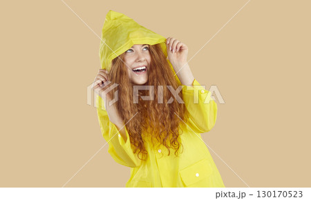 Portrait shot of happy beautiful red-haired young woman with long wavy hair. 130170523