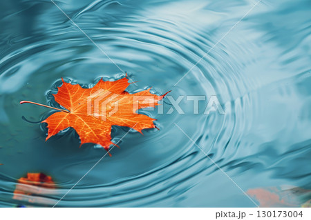 A maple leaf falling into an empty pond. AI generative 130173004