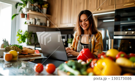 a woman using a tablet computer to cook in her kitchen Generative AI 130173086