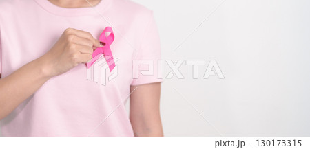 Pink October Breast Cancer Awareness month, woman with pink Ribbon for concepts of support people life and illness. National cancer survivors month, Women Health day and February World cancer day Pink October Breast Cancer Awareness month, woman with pink Ribbon for concepts of support people life and illness. National cancer survivors month, Women Health day and February World cancer day 130173315