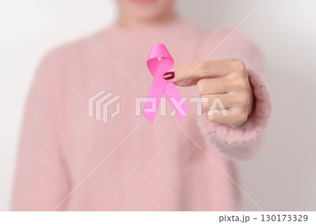 Pink October Breast Cancer Awareness month, woman with pink Ribbon for concepts of support people life and illness. National cancer survivors month, Women Health day and February World cancer day 130173329