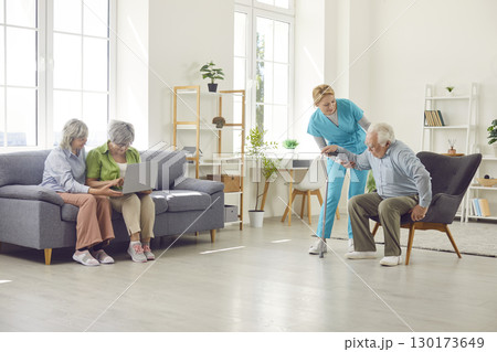 Retirement home room with skilled nurse and senior residents, nursing care and service for old  130173649