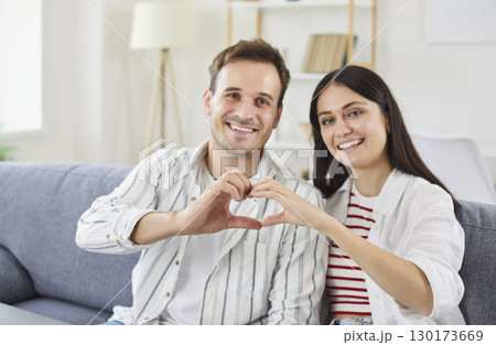 Couple Showing Heart Sign During Valentines Day Celebration 130173669