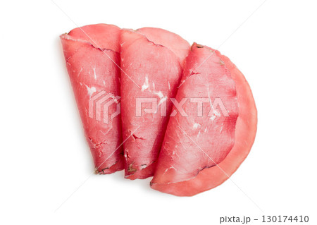 Slices of smoked bresaola isolated on white background. 130174410