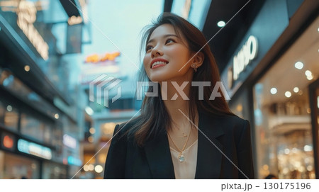 Stylish Young Woman in City at Night 130175196