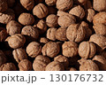 Many ripe walnuts in the shell close-up. Healthy eating, natural products, nut business, cooking and agriculture. 130176732