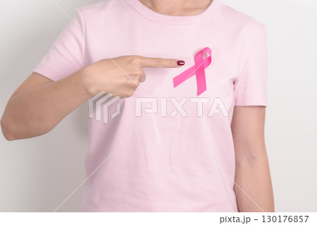 Pink October Breast Cancer Awareness month, woman with pink Ribbon for concepts of support people life and illness. National cancer survivors month, Women Health day and February World cancer day 130176857