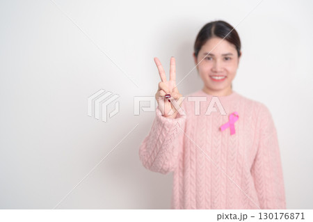 Pink October Breast Cancer Awareness month, woman with pink Ribbon for concepts of support people life and illness. National cancer survivors month, Women Health day and February World cancer day 130176871
