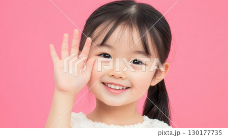 Cute Asian Girl Waving Hello 130177735