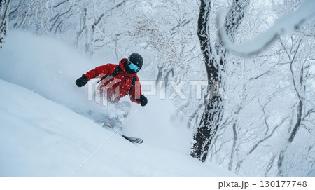 Skier in Snowy Forest 130177748