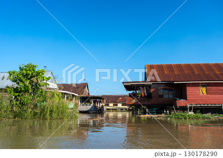 Houses on Lake Tempe, Sulawesi, Indonesia at sunrise 130178290