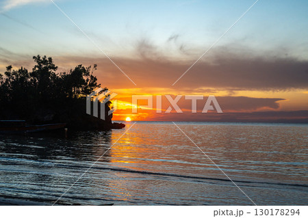 Sunset on Lia beach, Waleakodi Island, Togian archipelago, Sulawesi, Indonesia Sunset on Lia beach, Waleakodi Island, Togian archipelago, Sulawesi, Indonesia 130178294