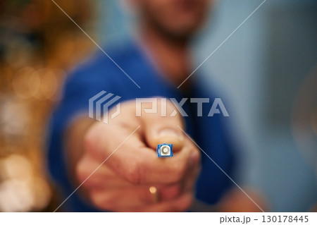 Close up view of man hand that is holding internet cable Close up view of man hand that is holding internet cable 130178445