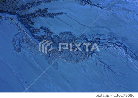 Aerial view of gray abstract mud patterns and cracks on acid mine drainage surface 130179086