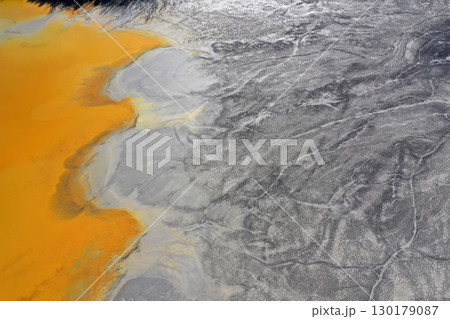 Patterns of acid mine drainage in decanting lake, nature pollution, aerial view 130179087