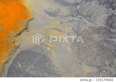 Flying over patterns of acid mine drainage in decanting lake aerial 130179088