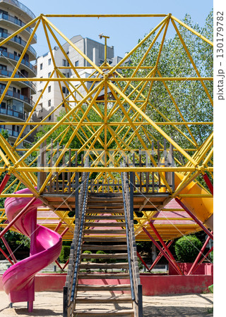 Colorful Playground Structure with Slides and Climbing Frames 130179782