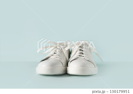 White women's new gumshoes on blue background. Washing and cleaning concept. 130179951