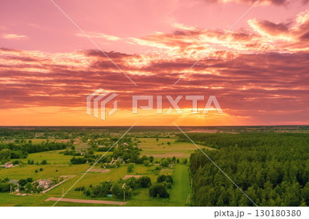 Rural landscape at sunset. Countryside in the evening. Aerial view Rural landscape at sunset. Countryside in the evening. Aerial view 130180380