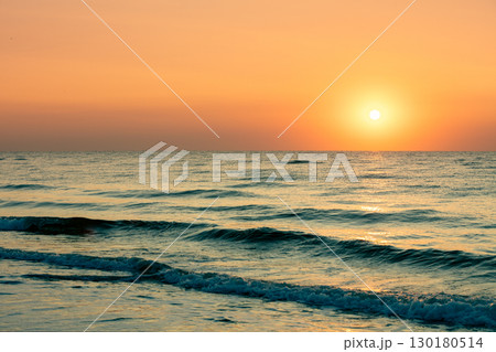 Seascape in the early morning. Beautiful orange sunrise over the sea Seascape in the early morning. Beautiful orange sunrise over the sea 130180514