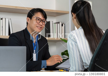 Car Insurance Meeting. Professional discussing insurance policy with a client. Car Insurance Meeting. Professional discussing insurance policy with a client. 130180801