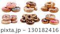 Small Pile group stack tower of round donut doughnut, with sprinkles nuts topping frosting on transparent background cutout, PNG file. Many assorted different. Mockup template 130182416
