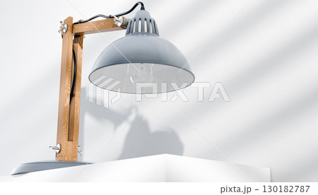 Retro or vintage style desk lamp, classic wooden arm with metal base and grey colored canopy, against white background, isolated. 130182787