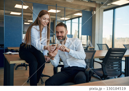 Man and woman employees are working in the office Man and woman employees are working in the office 130184519
