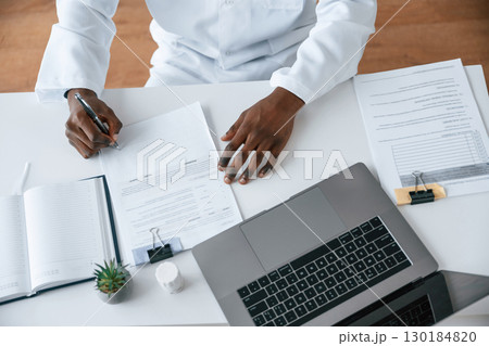 Black man as doctor in the clinic office 130184820