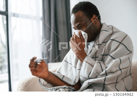 Sick black man is at home 130184982