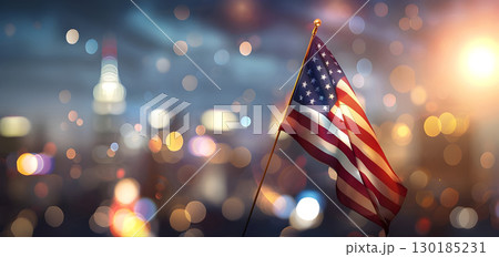 USA Flag Fluttering in Urban Landscape with Blurred Background, American Flag Waving Amidst Cityscape with Blurred Backdrop, Stars and Stripes Flying in the City with Blur Effect Background 130185231