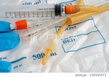 Foley catheter and urine drainage bag collect urine for disability or patient in hospital. 130185471