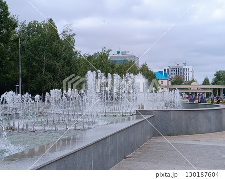 Kostanay, Kazakhstan - June 23, 2025: Fountain in the central park of the city. Kostanay, Kazakhstan - June 23, 2025: Fountain in the central park of the city. 130187604