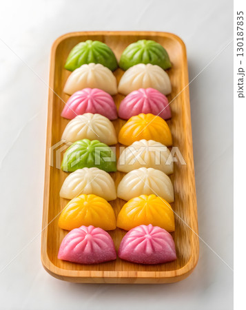 Delicious chuseok festive treats on a wooden tray for korean thanksgiving celebration 130187835