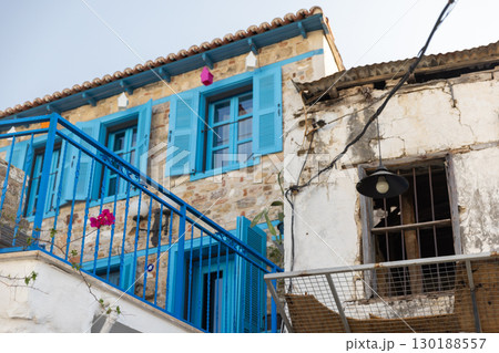 Marmaris, Turkey. Historic stone building with brightly painted shutters 130188557