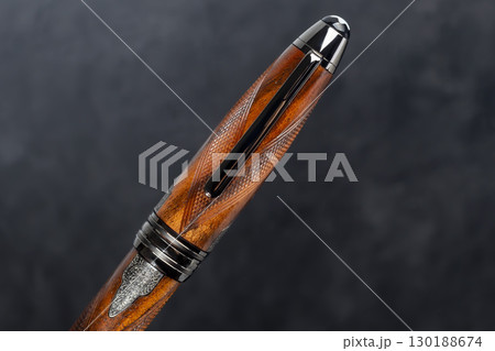 Fountain pen on dark marble background. Rare writing instruments. 130188674