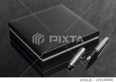Fountain pen on dark marble background. Rare writing instruments. 130188686
