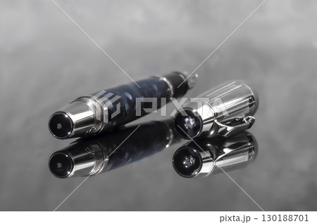 Fountain pen on dark marble background. Rare writing instruments. 130188701