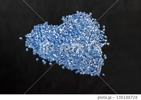 Bracelet and earrings made of beads on a light background. Handmade. Jewelry Bracelet and earrings made of beads on a light background. Handmade. Jewelry 130188728