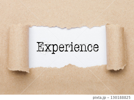 Experience text appearing behind torn brown paper Experience text appearing behind torn brown paper 130188825