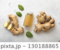 Immune ginger energy shot drink with fresh raw ginger root on light background.Macro. 130188865