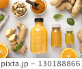 Ginger and orange energy shot immune drink with ginger root and turmeric powder.Top view. 130188866