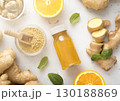 Immune ginger and orange energy shot drink with ginger root and grounded powder. 130188869