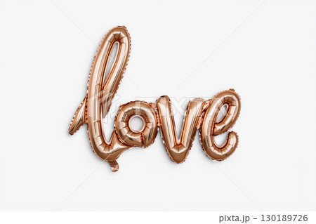 Decorative Rose Gold Love Balloon Reflects Light Beautifully at a Romantic Celebration or Event 130189726