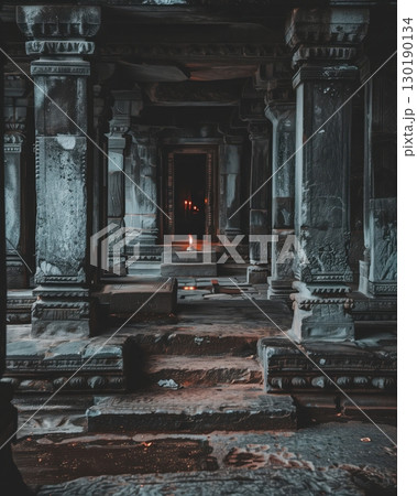 Single candle flickering in empty stone temple Single candle flickering in empty stone temple 130190134