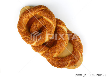 Turkish traditional bagel / simit with sesame on white background, turkish breakfast pastry concept Turkish traditional bagel / simit with sesame on white background, turkish breakfast pastry concept 130190425
